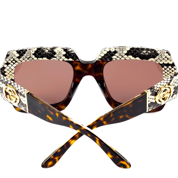 Authentic lightly used GUCCI sunglasses with real snake skin detail.